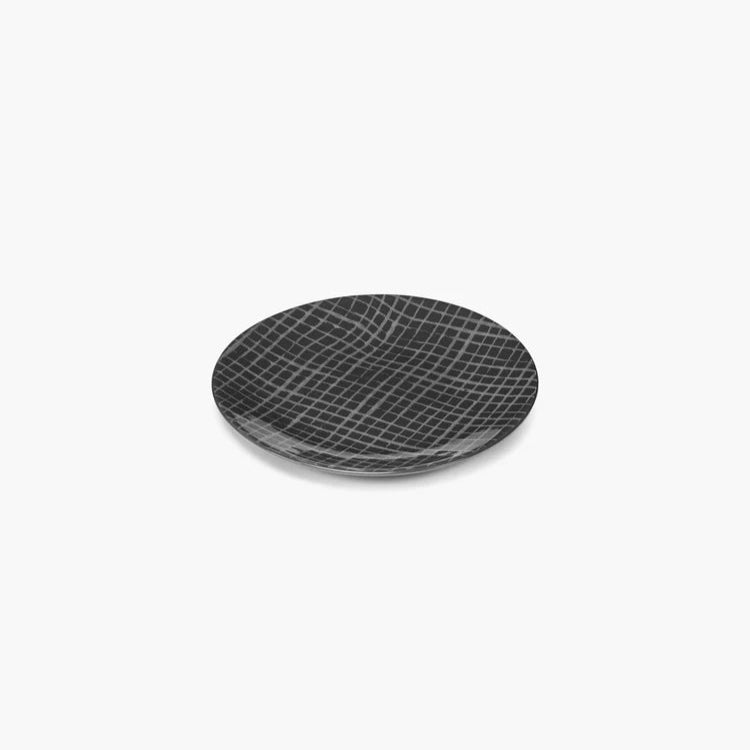 Black textured plate on a white background