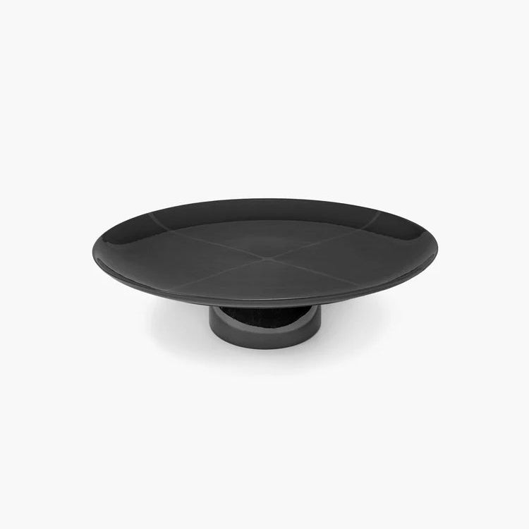 Black round tray on a white background