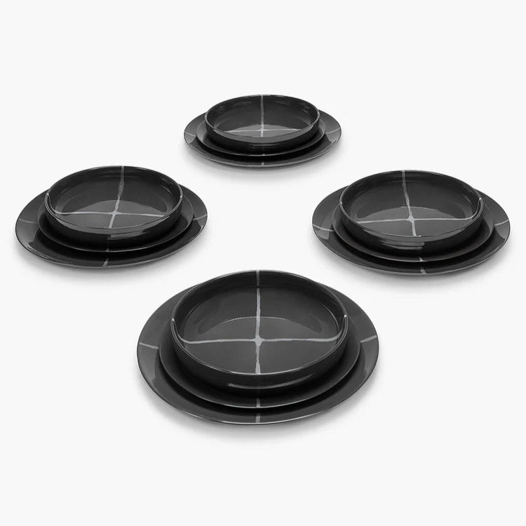 Set of black ceramic bowls on a white background