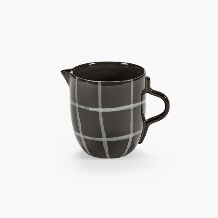 Black and white checkered pitcher on a white background