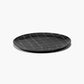 Black textured plate on a white background