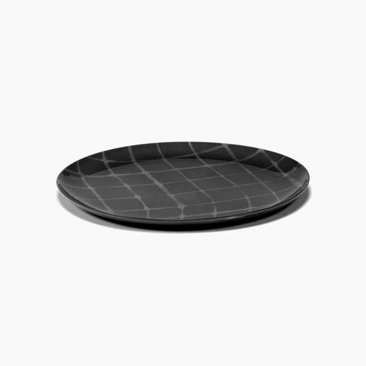 Black textured plate on a white background
