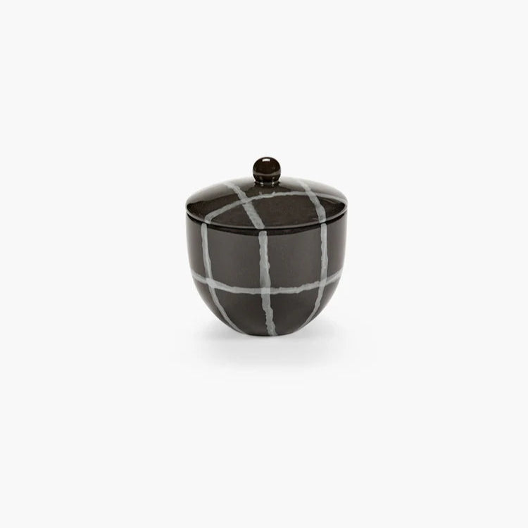 Ceramic sugar bowl with a checkered pattern on a white background