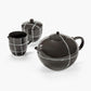 Black ceramic tea set with white lines on a white background