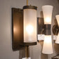 arteriors home Stefan wall sconce bronze frosted glass showroom