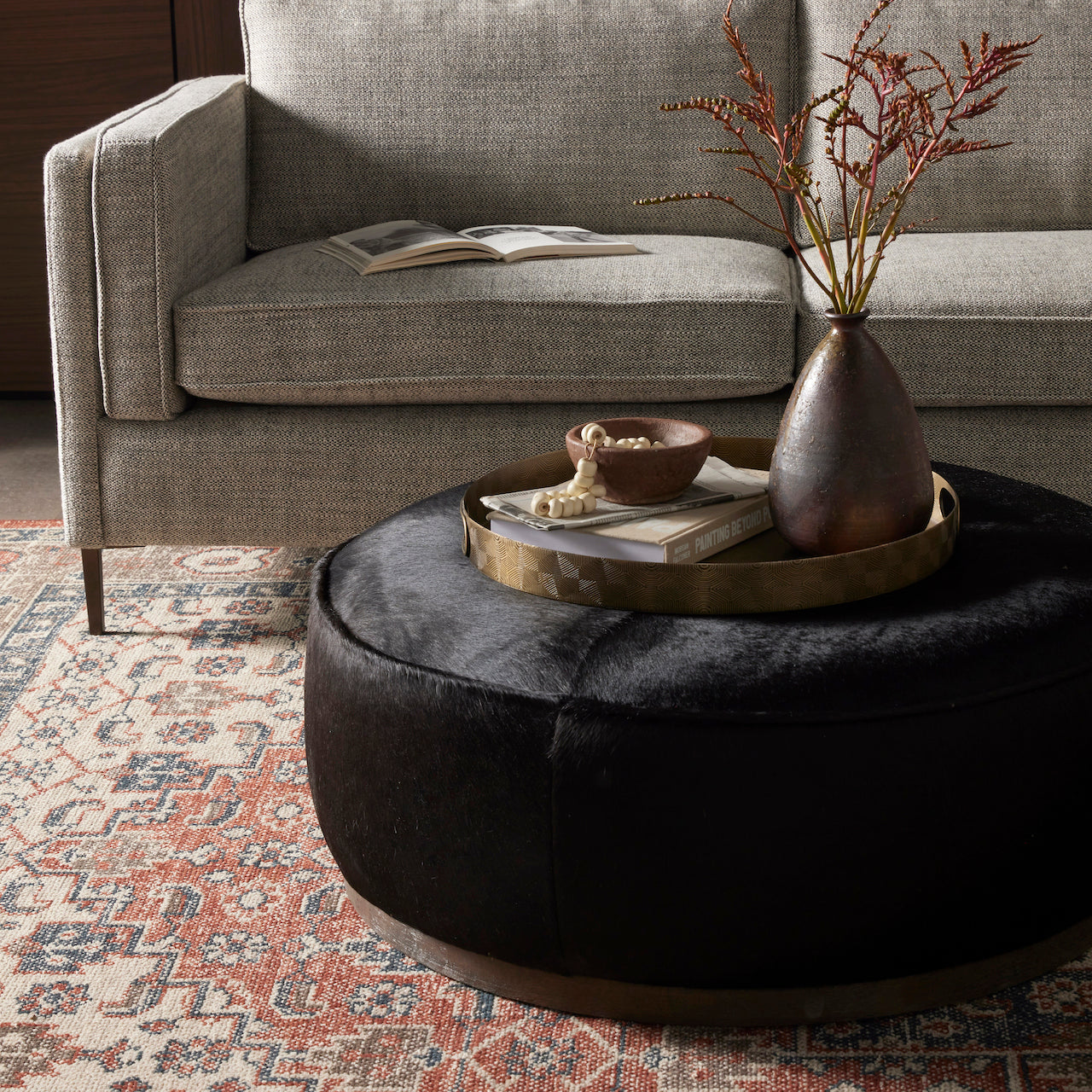 Round black leather ottoman deals coffee table