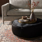 four hands sinclair large round ottoman black styled