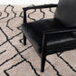 four hands stria outdoor rug styled with chair
