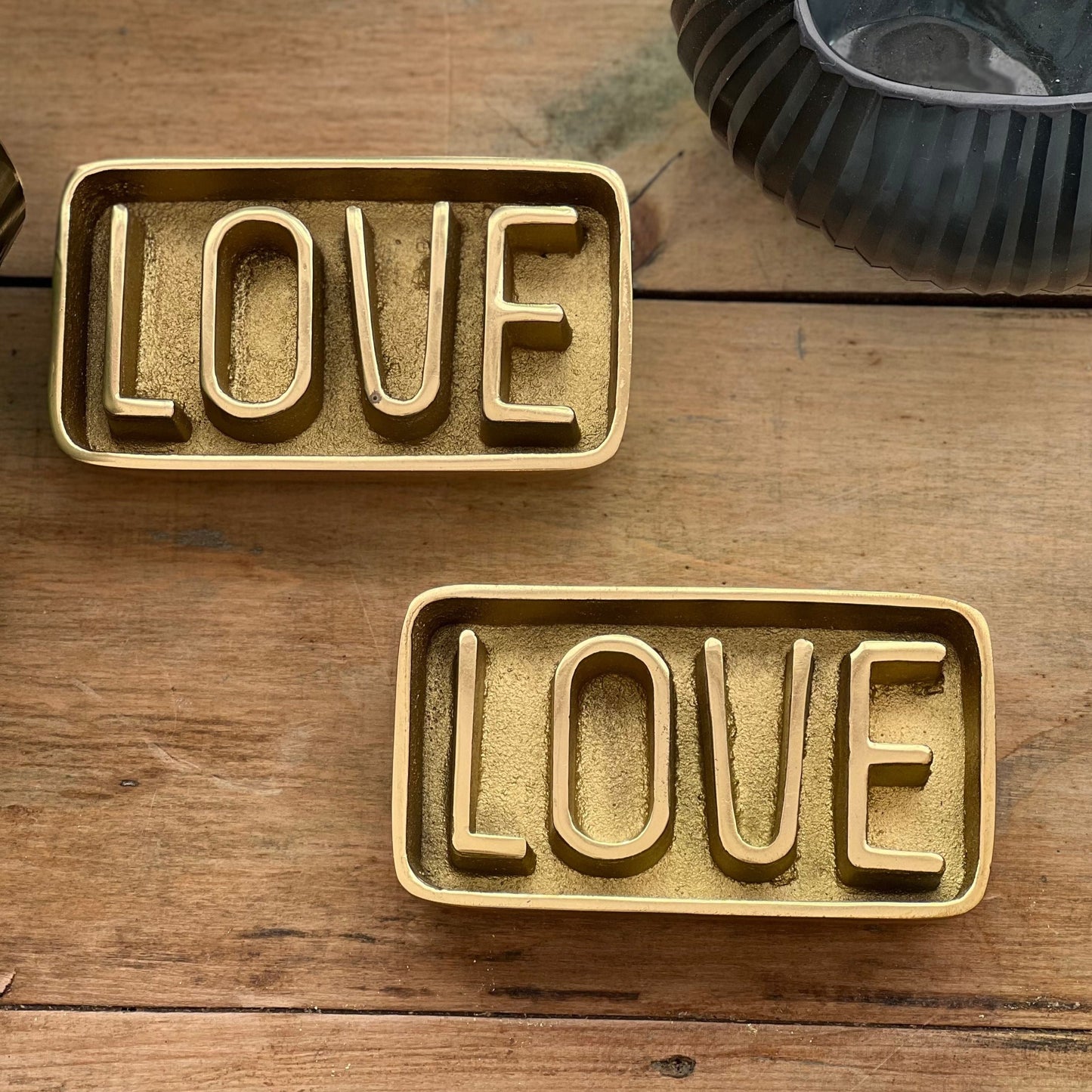 love brass paperweight front